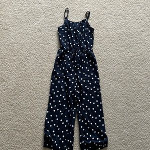 Black jumpsuit with white polka dots with pockets